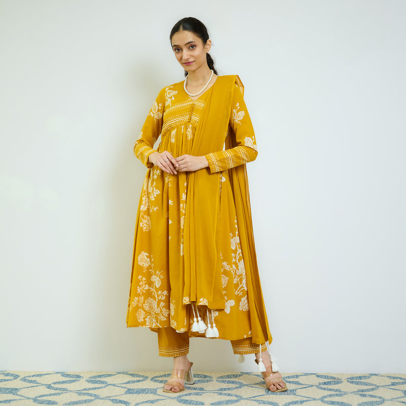 Zehra Yellow Cotton Kurta Set with Mul Cotton Dupatta & Tassel Detail